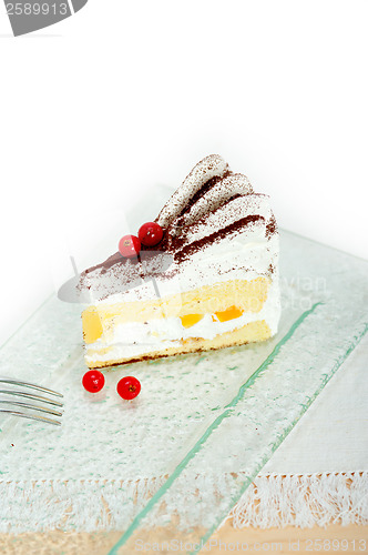 Image of whipped cream and ribes dessert cake slice