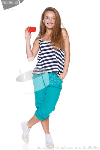 Image of Positive teen girl smiling showing credit card