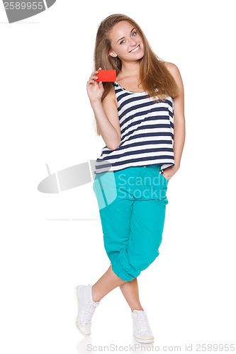 Image of Positive teen girl smiling showing credit card