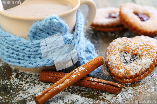 Image of Cookies in the form of heart, cinnamon and cocoa.