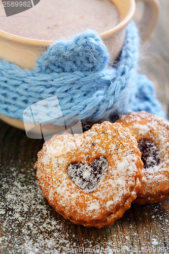 Image of Cocoa and Linzer Cookie .