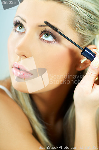 Image of Girl doing makeup