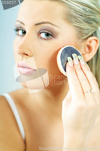 Image of Girl doing makeup