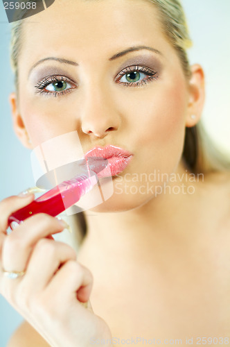 Image of Girl doing makeup