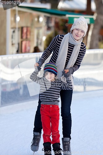 Image of family ice skating