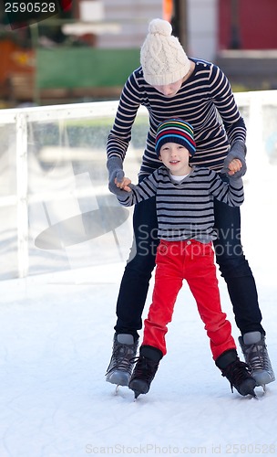 Image of family ice skating