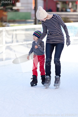 Image of family ice skating