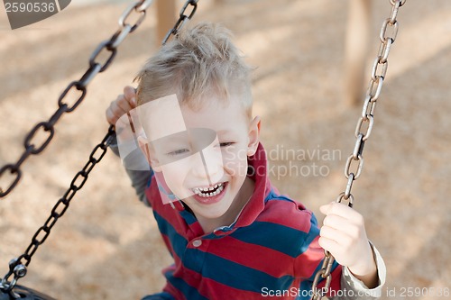 Image of kid at the swing