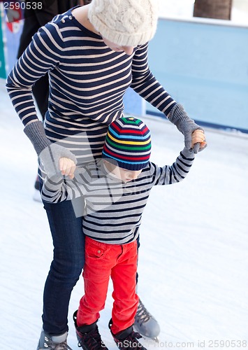 Image of family ice skating