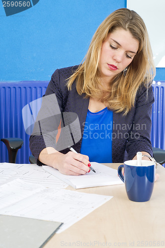 Image of Concentrated woman working