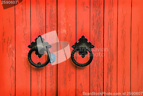 Image of Red wooden door with round handles