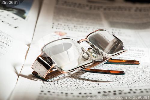 Image of Glasses on newspaper