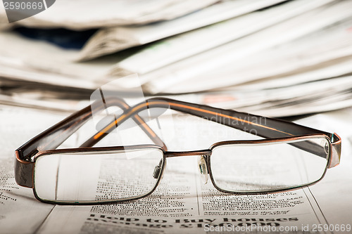 Image of Glasses on newspaper