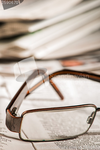 Image of Glasses on newspaper