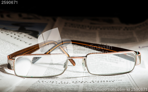 Image of Glasses on newspaper