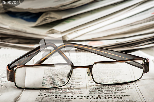 Image of Glasses on newspaper