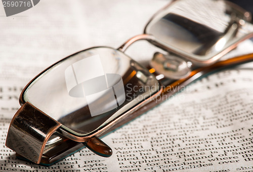 Image of Glasses on newspaper