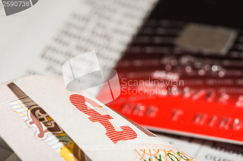 Image of Credit cards and banknotes on newspaper