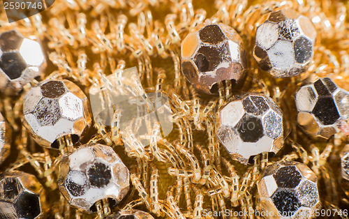 Image of Shiny ornaments on handbag