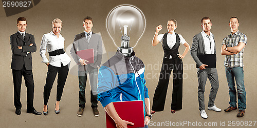 Image of Business Team With Lamp Head