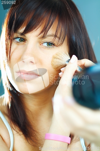 Image of Girl doing makeup