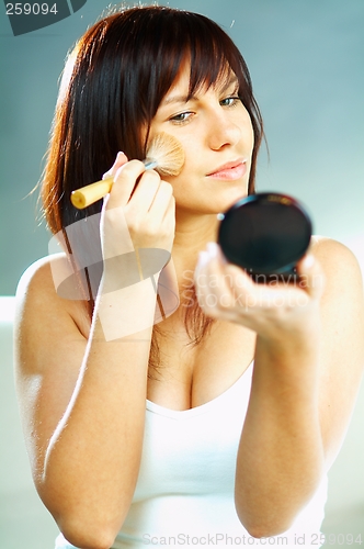 Image of Girl doing makeup