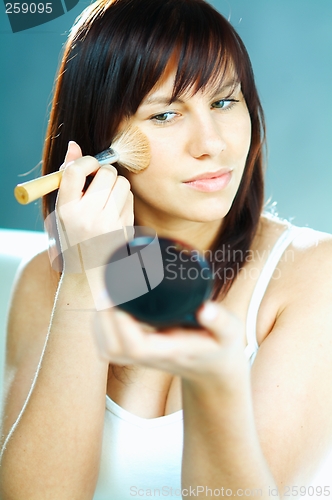 Image of Girl doing makeup