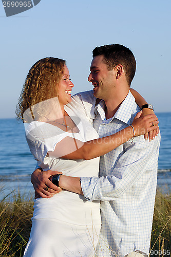 Image of Happy young couple at beach