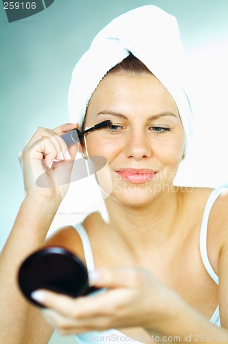 Image of Girl doing makeup