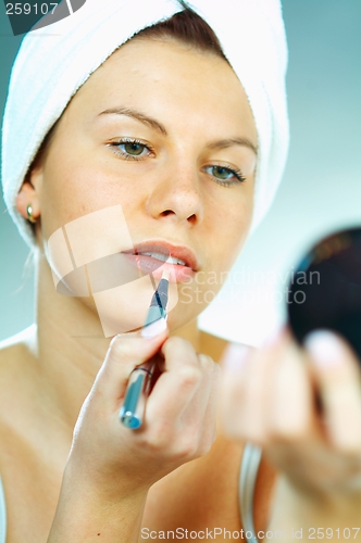 Image of Girl doing makeup