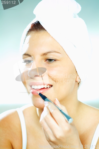 Image of Girl doing makeup