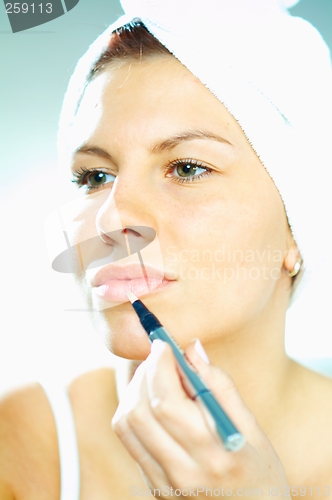 Image of Girl doing makeup