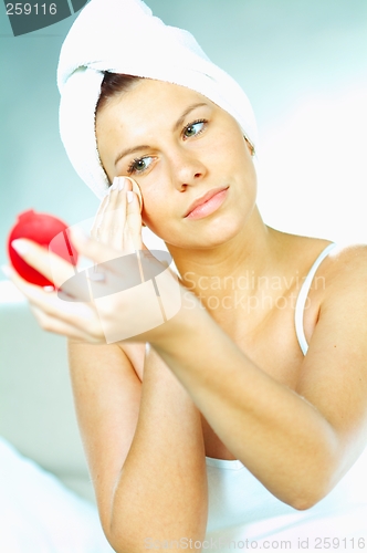 Image of Girl doing makeup