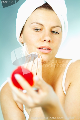 Image of Girl doing makeup