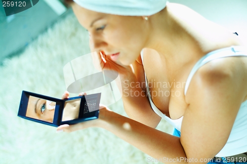 Image of Girl doing makeup