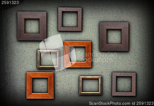 Image of colorful wood frames on green wall