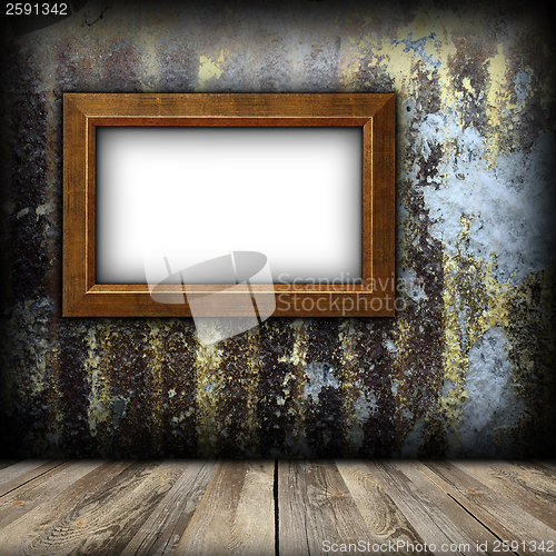 Image of ancient painting frame on weathered wall