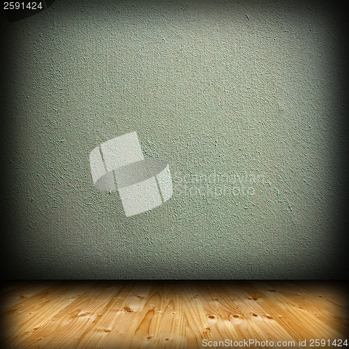 Image of wood floor and green plaster