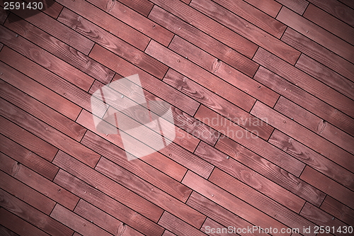 Image of textured wood tiles mounted for floor finishing