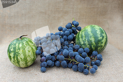 Image of still life from two watermelons and grape