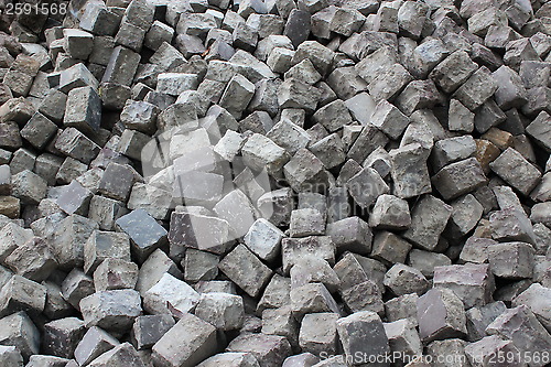 Image of stone blocks prepared for making road