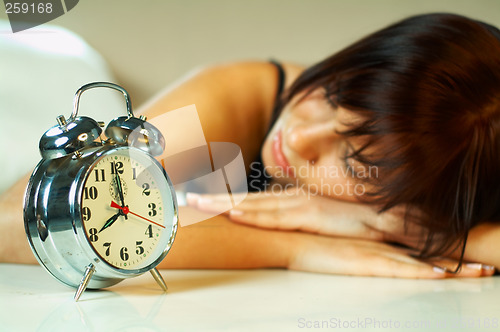 Image of brunette with clock