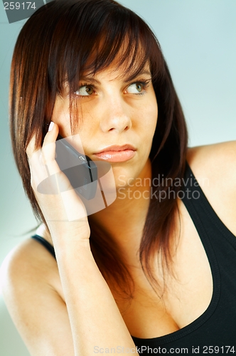 Image of Woman talking cell phone