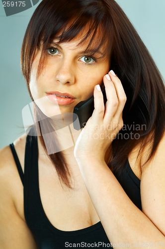 Image of Woman talking cell phone