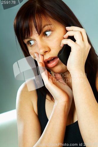 Image of Woman talking cell phone
