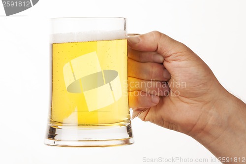 Image of hand holding glass of beer