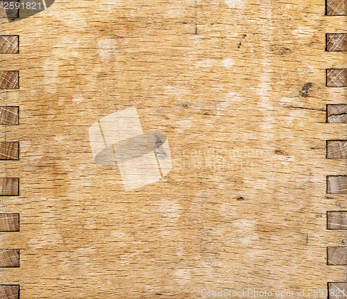 Image of wooden part of coffee grinding machine