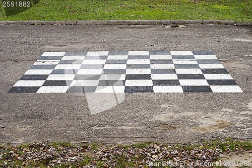 Image of chess board painted on the ground