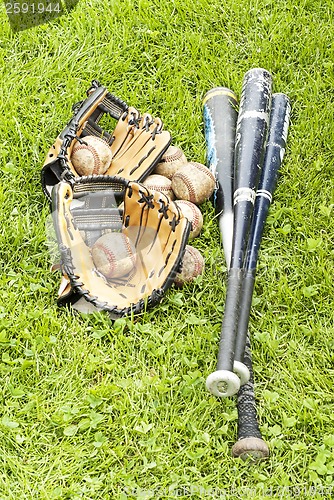 Image of baseball equipment on the grass