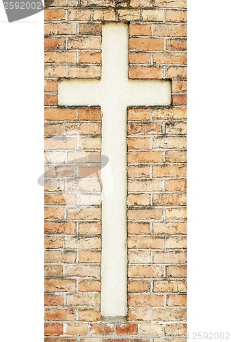 Image of cross on the weathered red brick wall